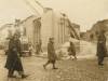 The Poles and Jews walking near the burnt synagogue