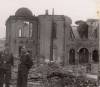 Germans posing at front burnt synagogue...